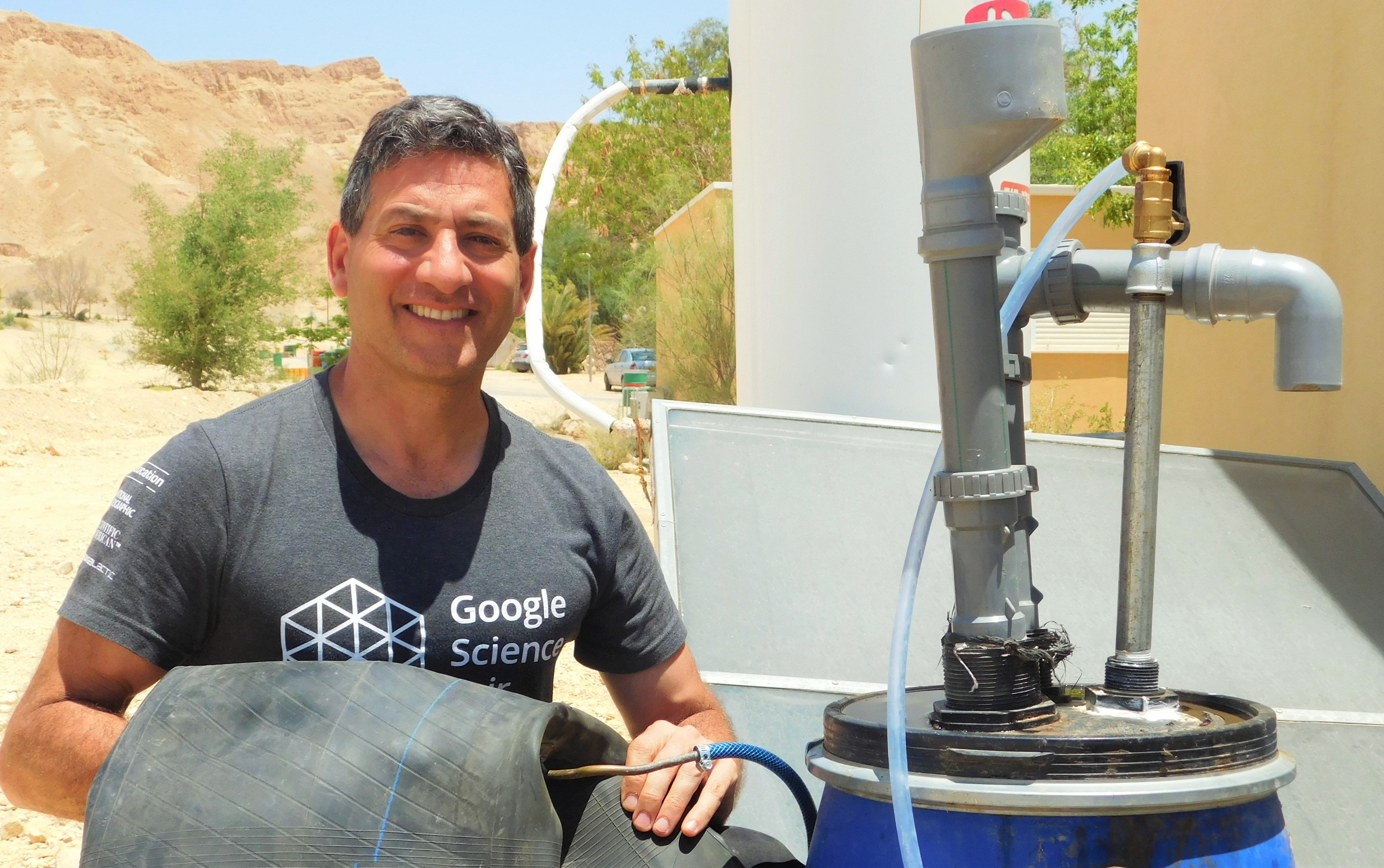 T.H. Culhane, co-founder of Solar CITIES, at Arava Institute in Israel with Pickel Barrel Biodigester