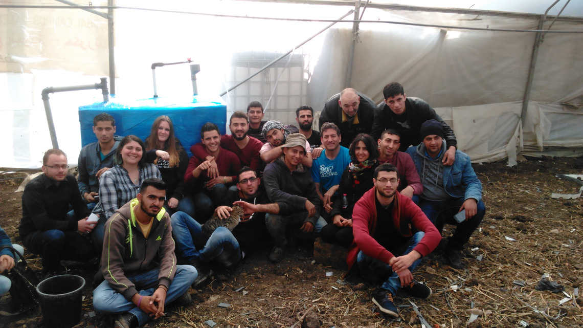 Solar CITIES, Envisaj Mercy and Palestinian Polytechnic students build our "refugee camp" IBC based biodigester in a greenhouse at Hakoritna Farm