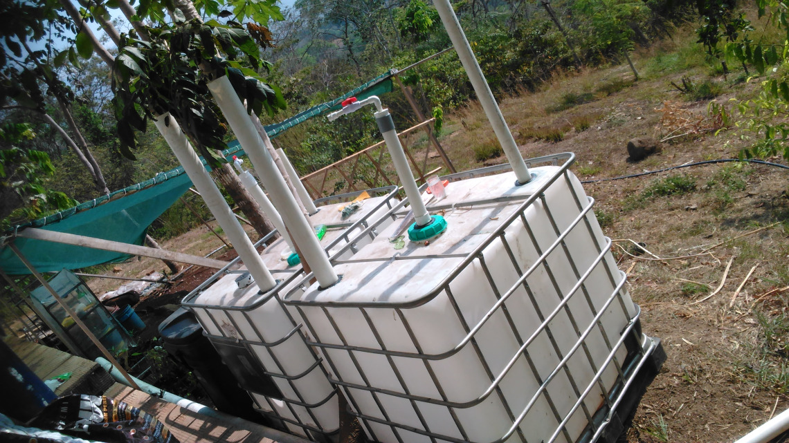 Solar CITIES IBC Biodigester under construction outside the eco-lodge kitchen