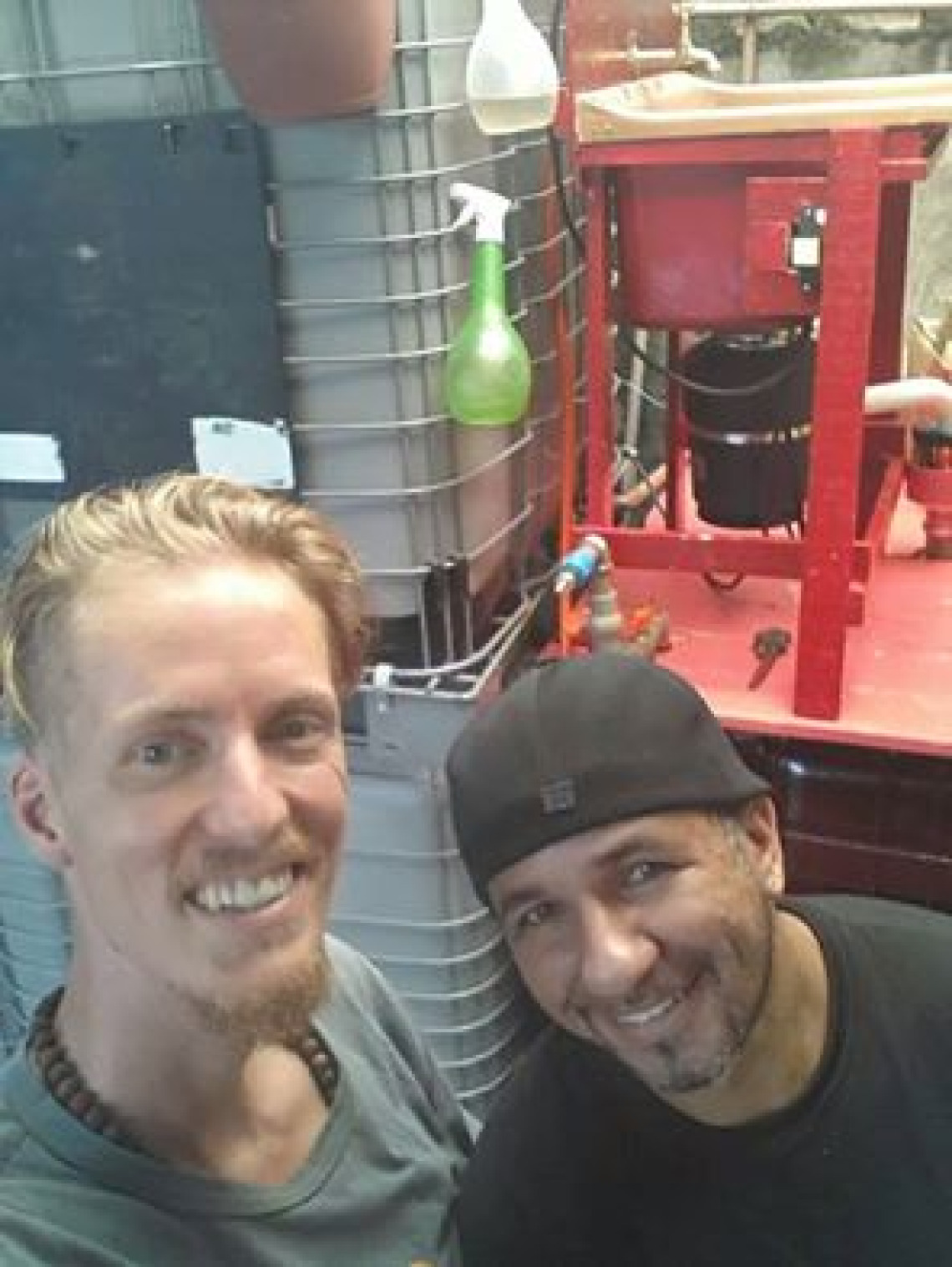 Visionary permaculturists Paulo Mellett and Fabio Poesia Sambasoul in front of their Insinkerator and Solar CITIES biogas system in Sao Paulo