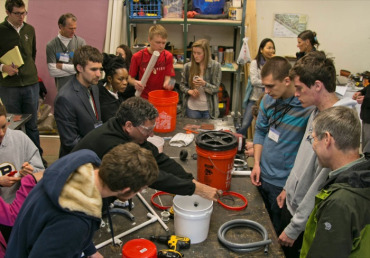 Culhane teaches participants to build a mini biodigester